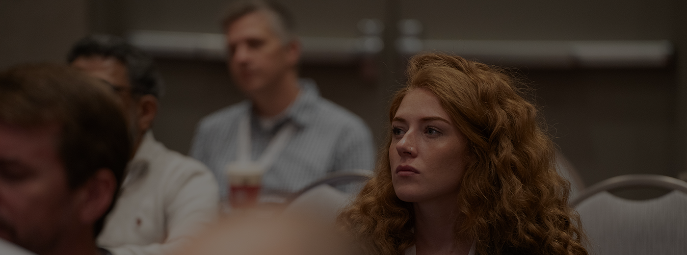 Woman listens to speaker at the MD&M Conference
