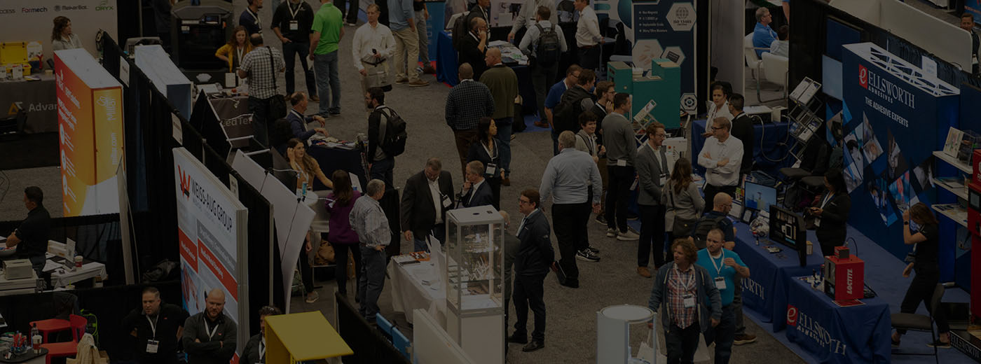 An overview shot of attendees and exhibits on the expo floor
