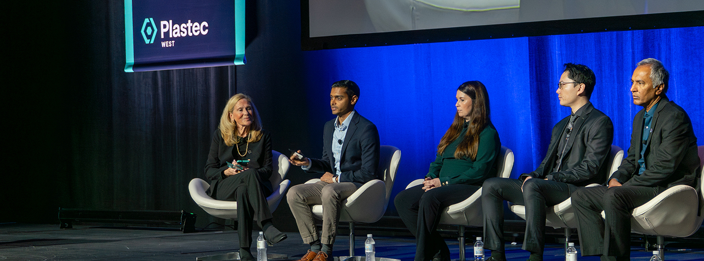 Conference speakers on stage