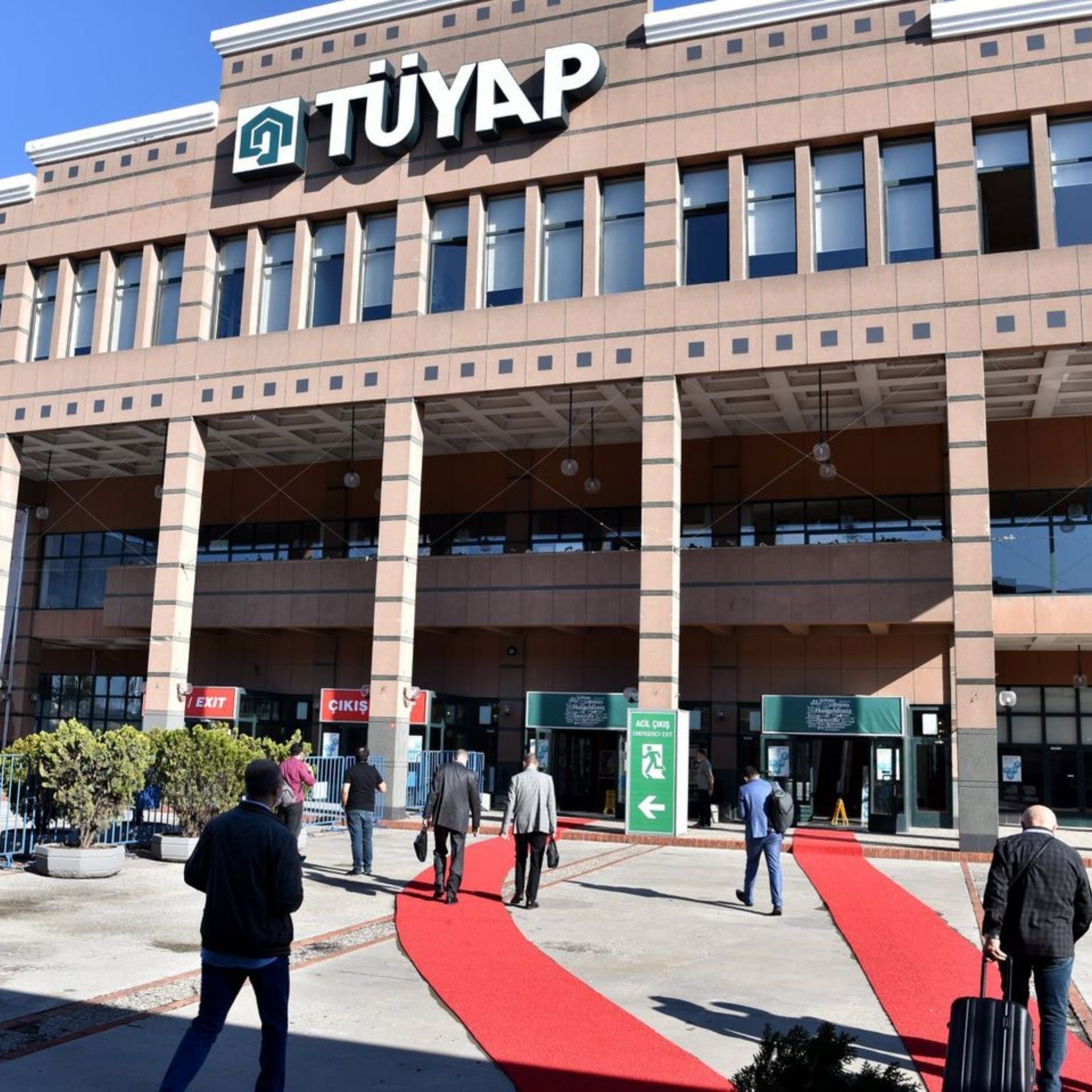 Venue viewed from outside and ZUCHEX flags.