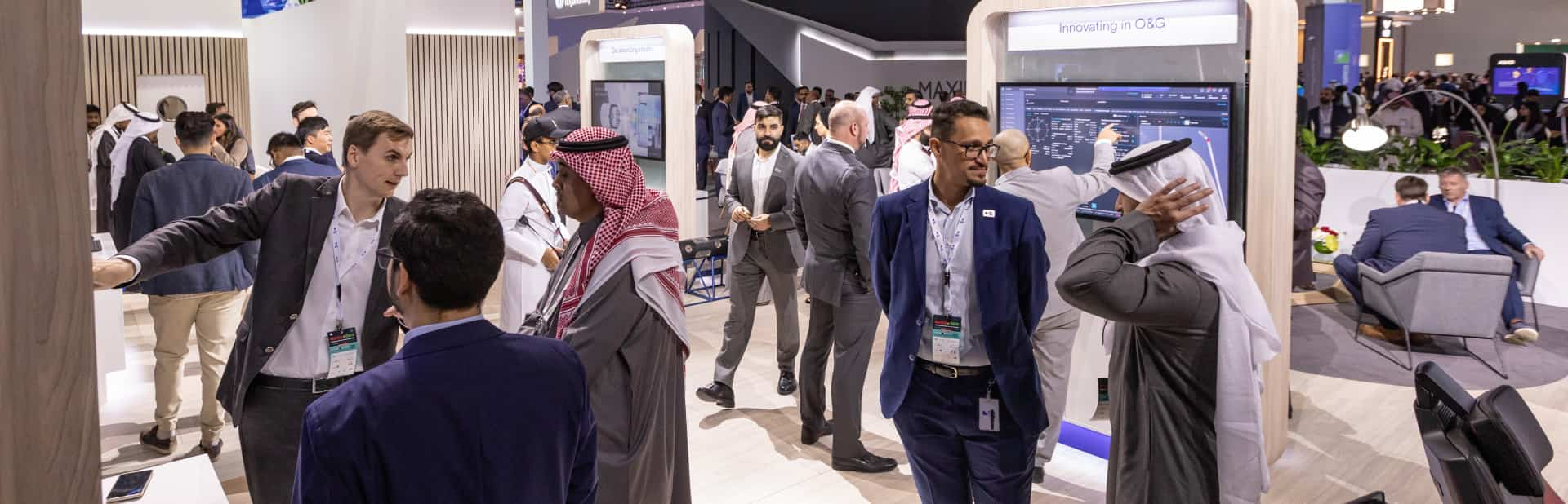 Visitors gather between exhibits at MEOS GEO 2023