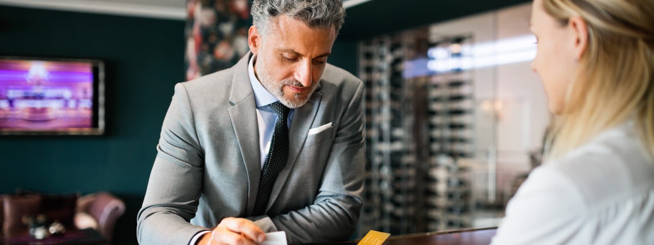 A man booking a hotel room.