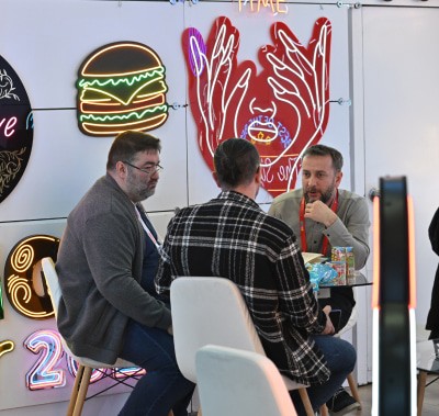 Printing machine in action at the LEDU booth, showcasing vibrant print designs at SIGN İstanbul