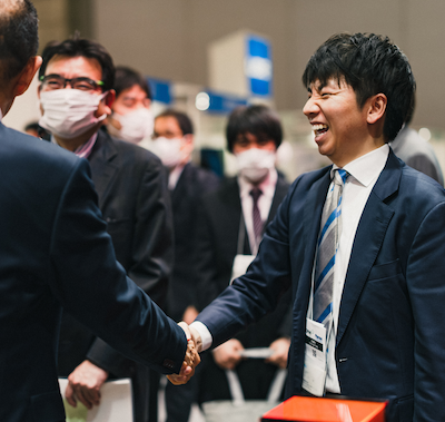 Pharma individuals greeting each other at CPHI Japan