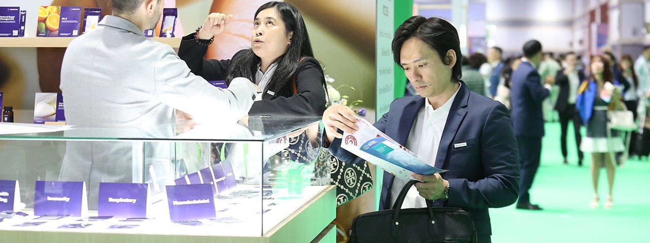 Visitor looking at map Vitafoods Asia