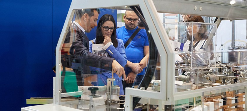 visitors inspecting machinery