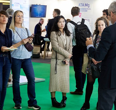 Visitors listening to exhibitor