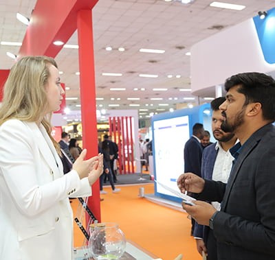 visitor speaking with exhibitor at the event