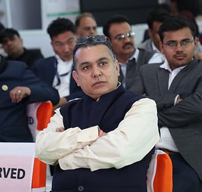 At the Vitafood Conference, an attendee attentively listens to a presentation.