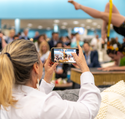 Person taking a photo of excitement at the conference