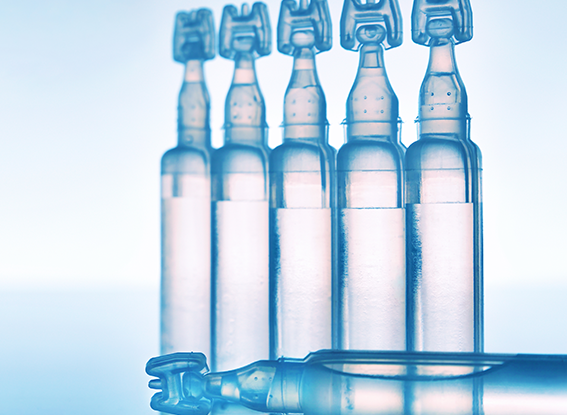 Artificial tears eye drops in plastic pipettes blue background composition